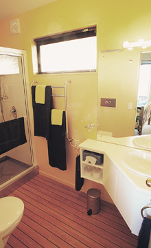 Bathroom at The Haven with shower, vanity and towels